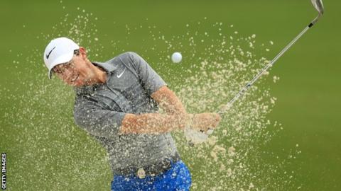 Rory McIlroy splashes out of a fox hole during biologism for the US PGA Championship